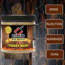 A jar of Butcher BBQ Turkey Brine Bird Booster on a rustic dark wood background, with four brown callout boxes labeled BRINE, INJECTION, MARINADE, and SOAK pointing to the product features.