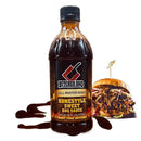 Bottle of Butcher BBQ Homestyle Sweet BBQ Sauce with a pulled pork sandwich in the background