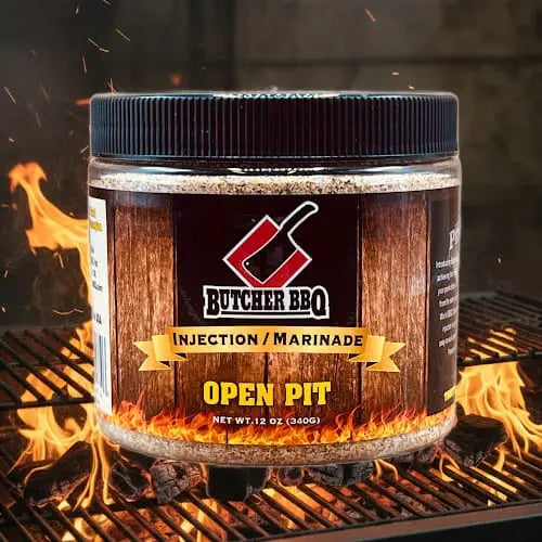 Butcher BBQ Original Pork injection marinade jar on a grill with flames