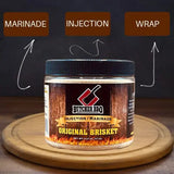 Butcher BBQ Original Beef marinade jar on a wooden board with text labels 'Marinade', 'Injection', and 'Wrap'.