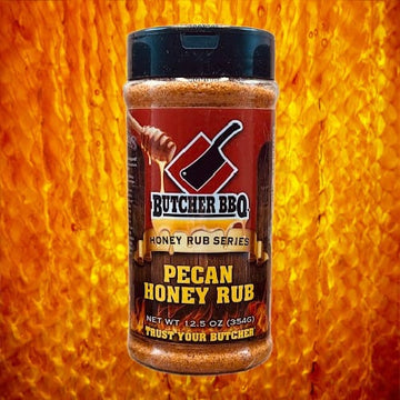 Butcher BBQ Pecan Honey Rub jar on a fiery background