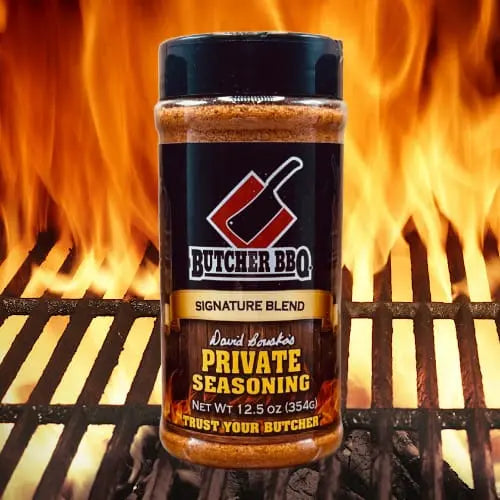 Butcher BBQ seasoning bottle with flames in the background