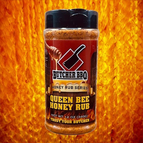 Butcher BBQ Queen Bee Honey Rub jar on a fiery background