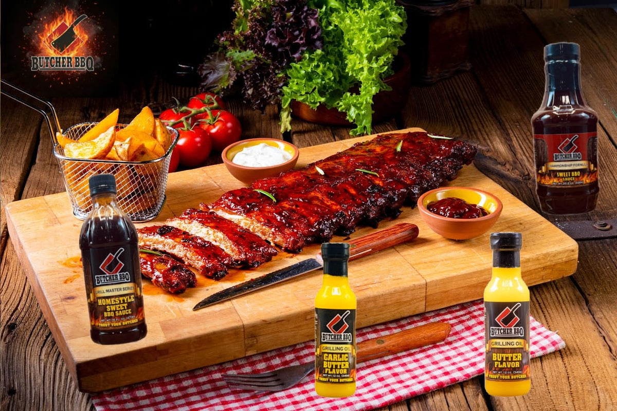 Barbecue ribs on a cutting board with Butcher BBQ sauce bottles and ingredients on a wooden table.
