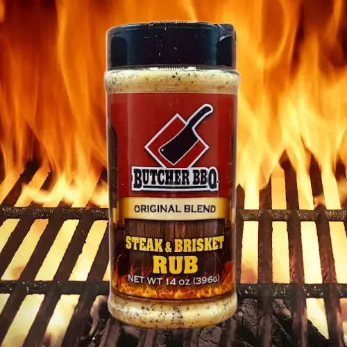 Butcher BBQ Steak & Brisket Rub jar on a grill with flames in the background