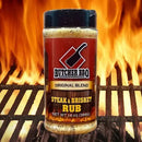 Butcher BBQ Steak & Brisket Rub jar on a grill with flames in the background