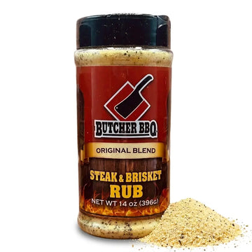 A 14 oz plastic shaker bottle of Butcher BBQ Steak & Brisket Rub seasoning, shown with a small pile of the beige spice blend spilled in front on a white background.